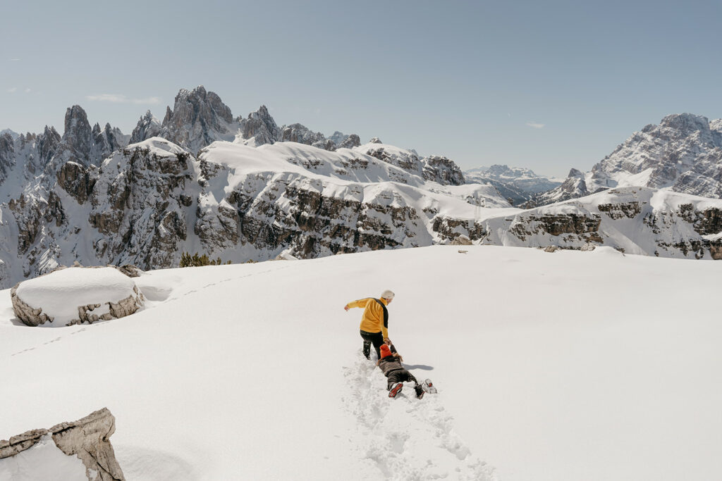 Hikers in snow with mountain view.