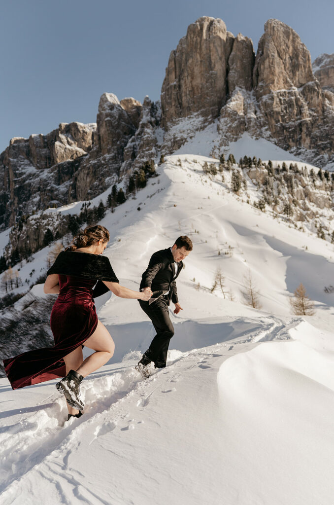 Couple hiking in snowy mountains.