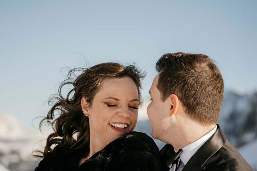 Couple smiling outdoors in winter setting