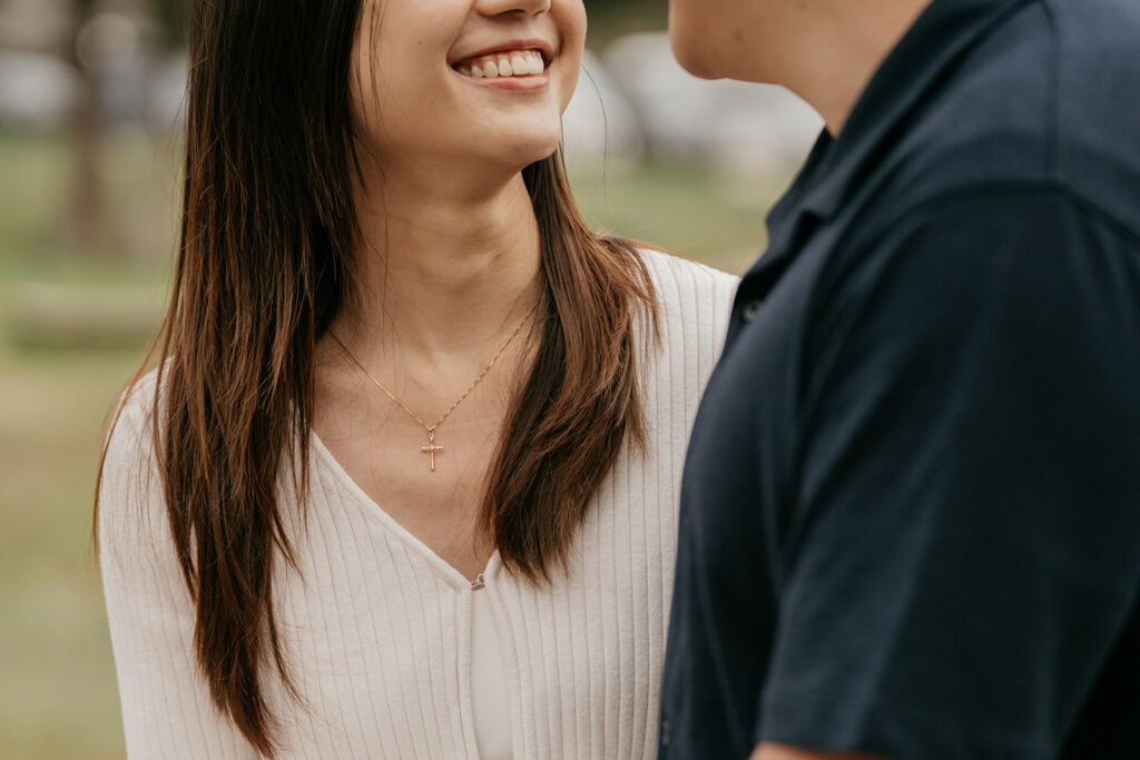 Couple sharing a joyful moment outdoors.