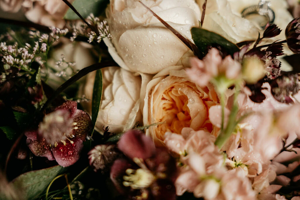 Close-up of dewy bouquet with white and pink flowers.