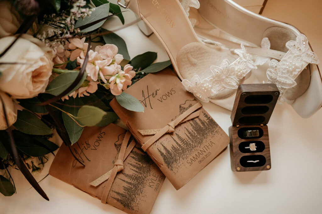 Wedding vows, rings, shoes and floral arrangement.