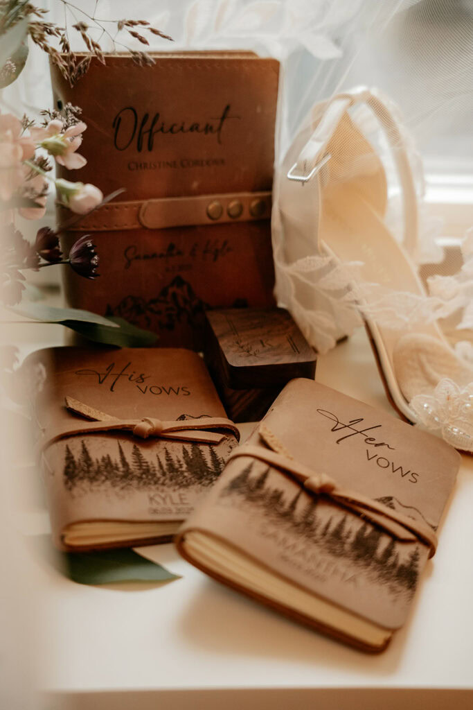 Wedding vow books and white heeled shoe
