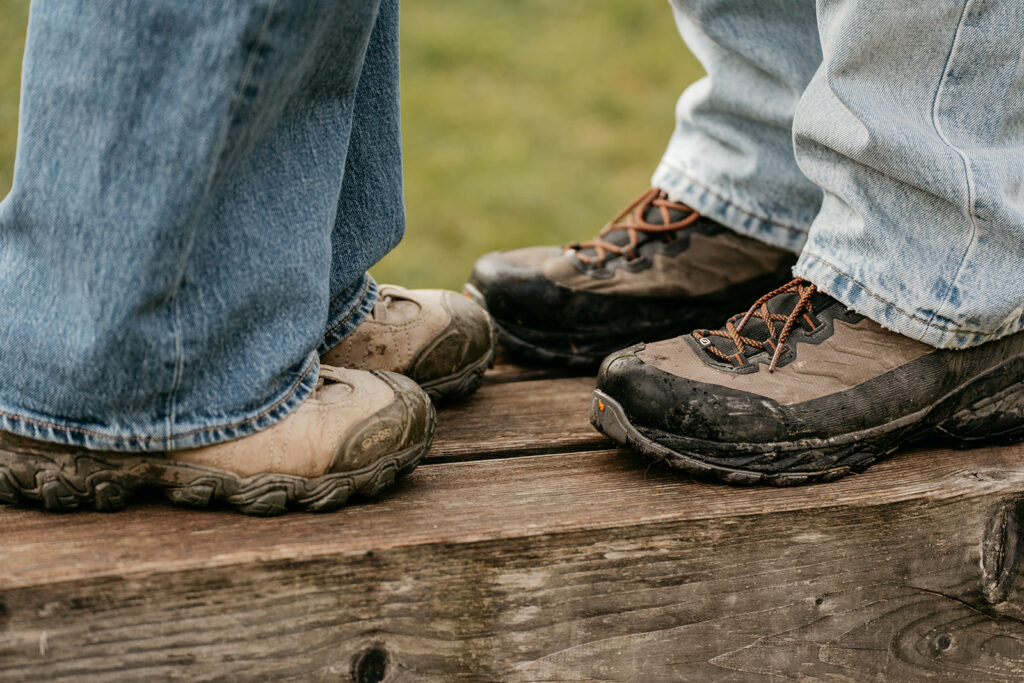 Close-up of two people wearing hiking boots