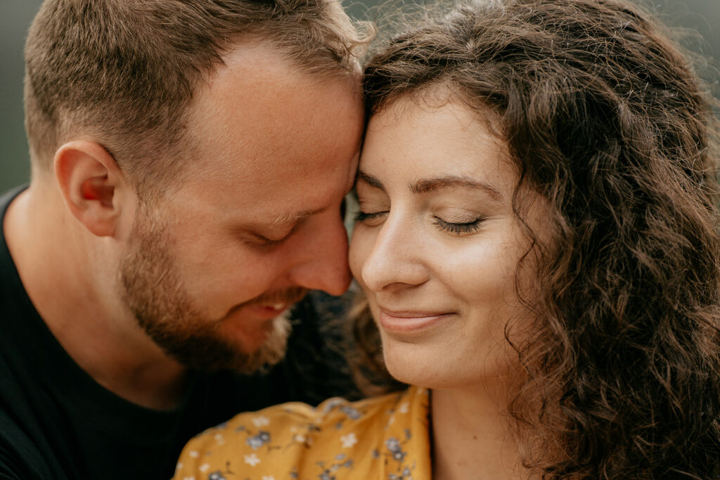 Couple embracing lovingly outdoors.