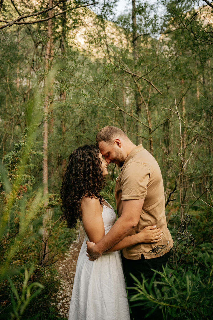 Couple embracing in forest