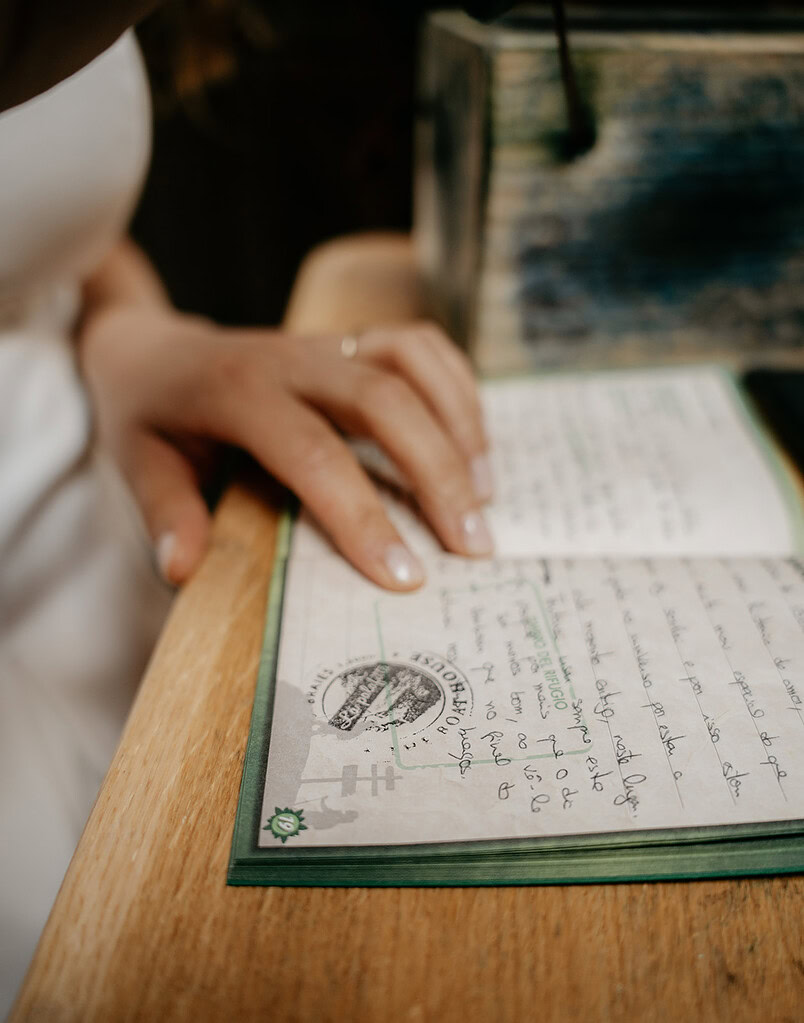 Person reading handwritten text in a notebook