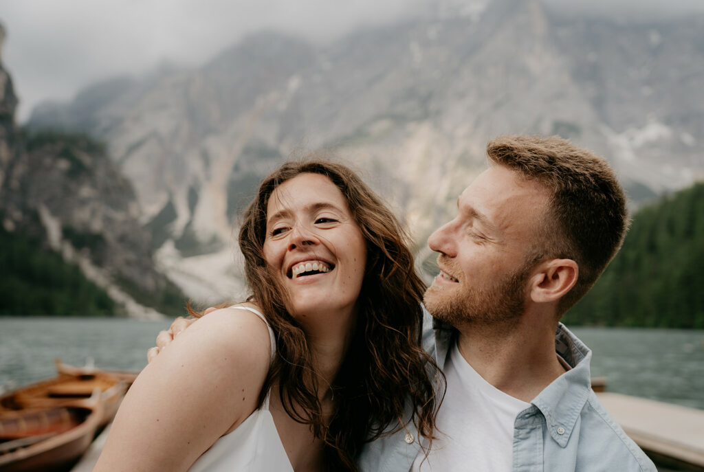 Happy couple near mountain lake