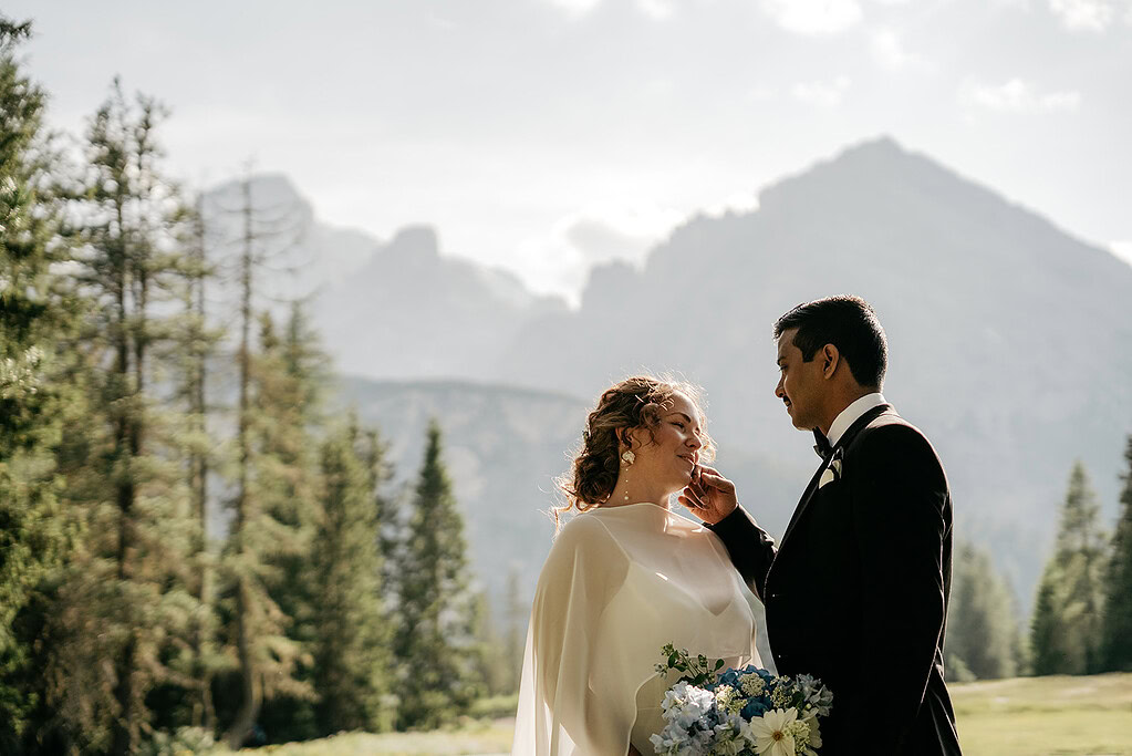 Wedding couple in scenic mountain background