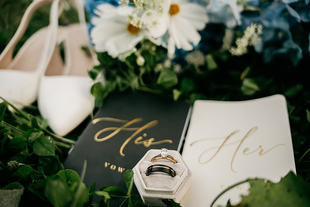Wedding rings with vows and flowers