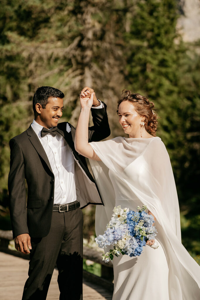 Bride and groom dancing outdoors at wedding