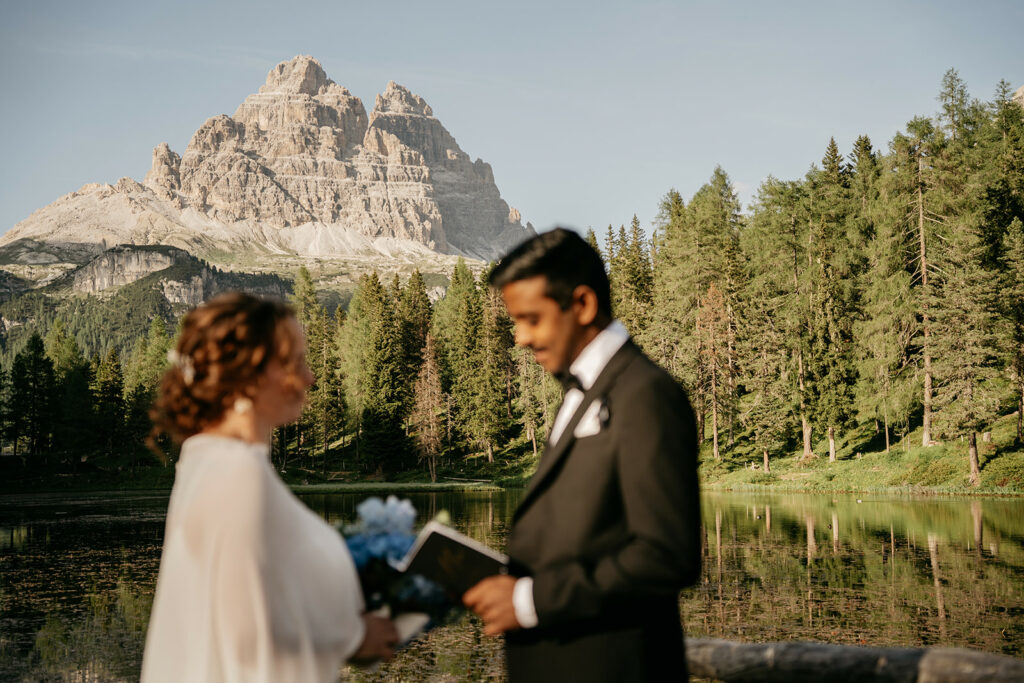 Couple at scenic mountain wedding ceremony.