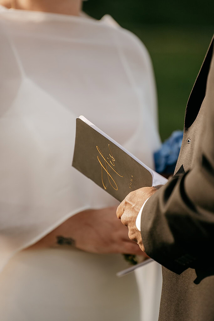 Couple exchanging vows at wedding ceremony.