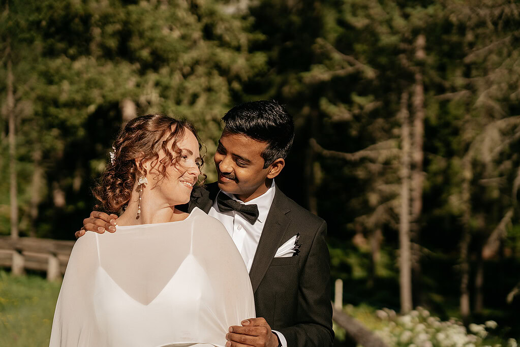 Smiling couple in a forest setting
