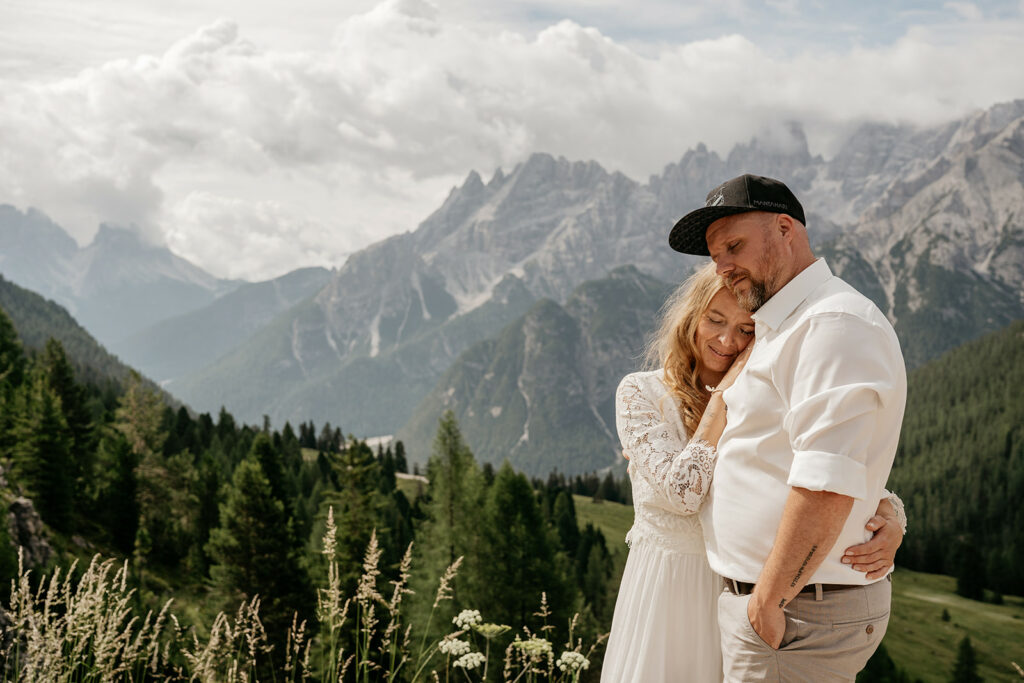 Couple embraces in scenic mountain landscape
