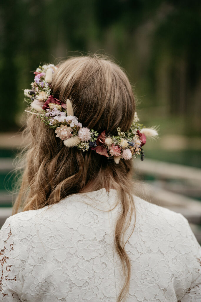 Woman with floral hair wreath in lace dress