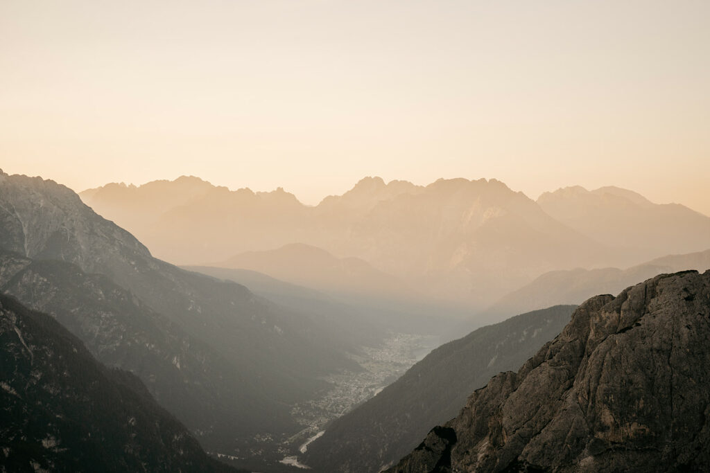 Misty mountain landscape at sunrise.