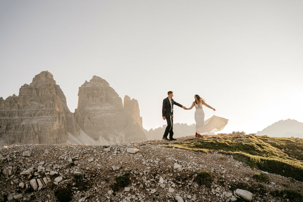 Couple holding hands in mountain landscape