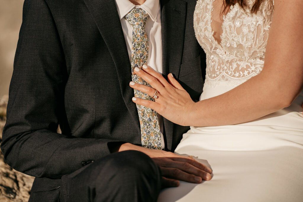 Bride and groom holding hands on wedding day.