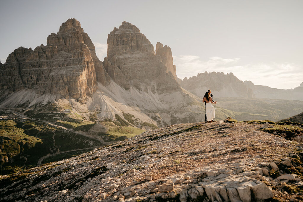 Couple embracing in front of mountain landscape