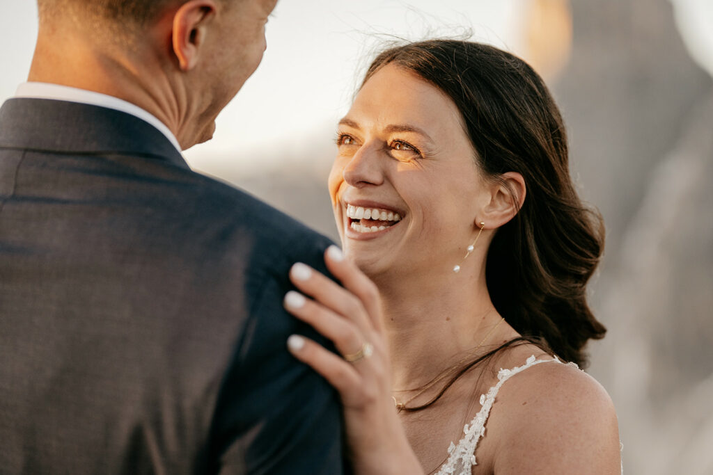Smiling couple embracing outdoors.