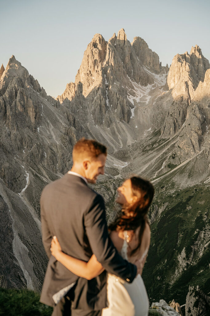 Couple embracing with scenic mountain view.