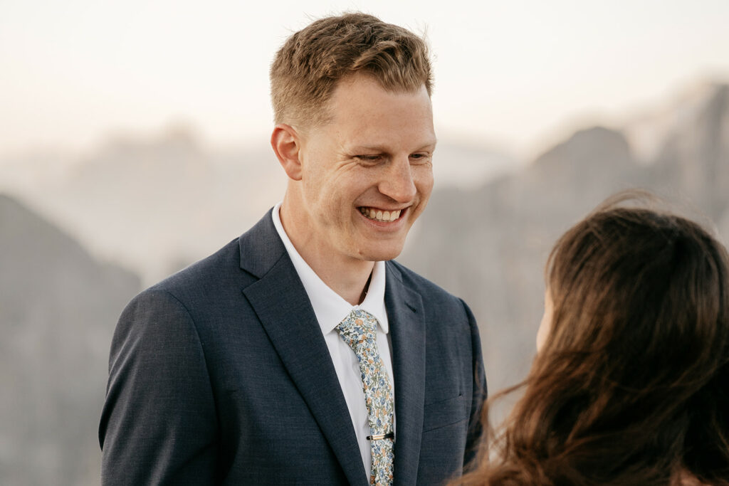 Smiling man in suit during outdoor conversation