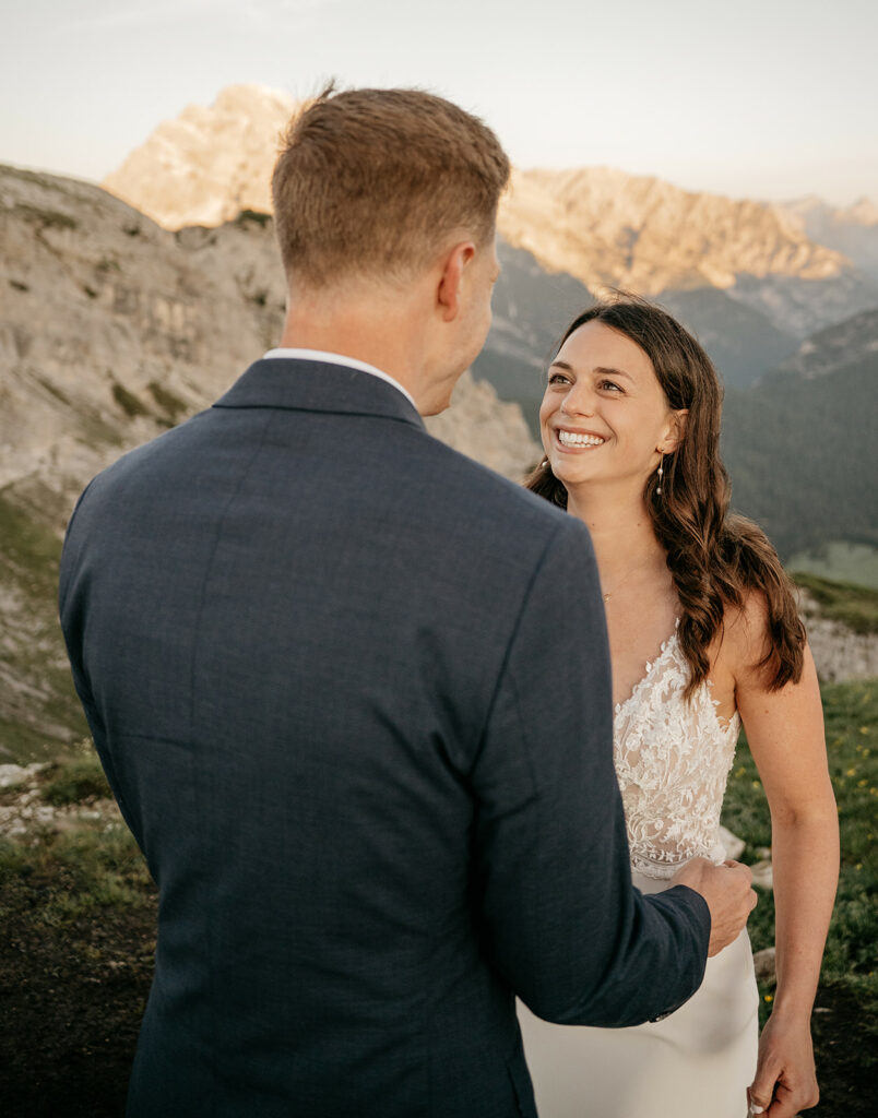 Couple on mountaintop during wedding ceremony.