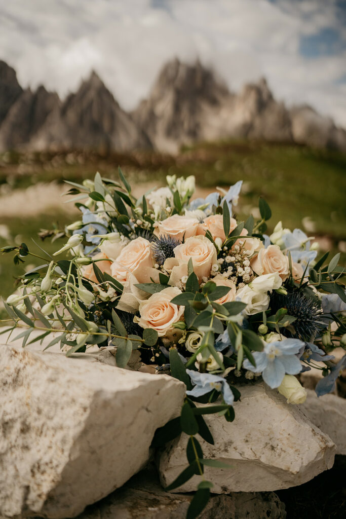 Bouquet of roses on rocky mountain background