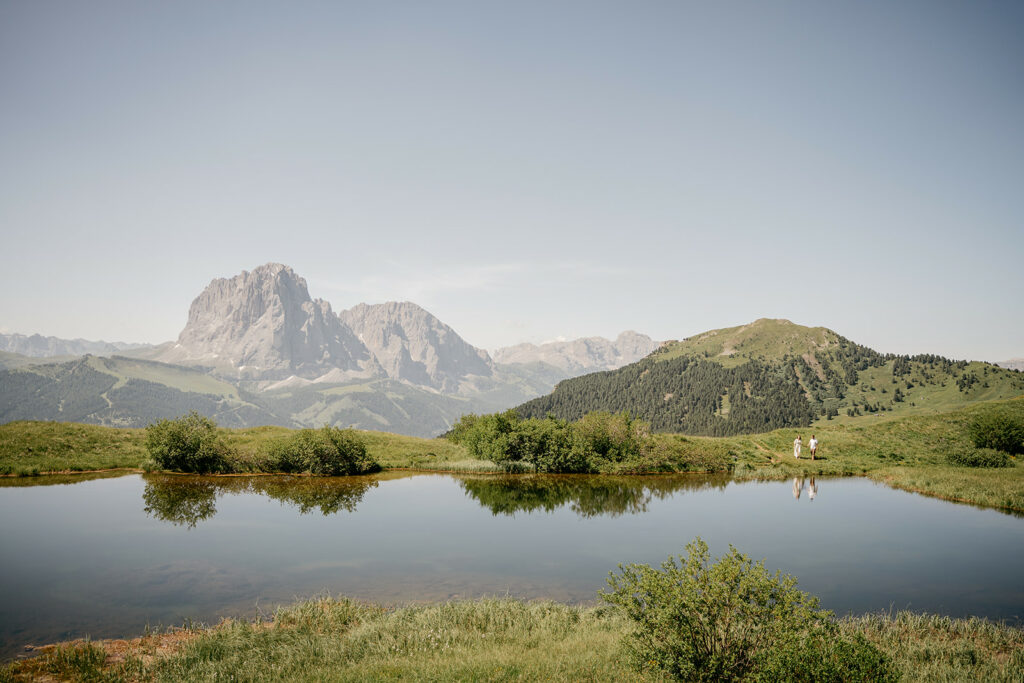 Tranquil mountain landscape with clear pond reflection.