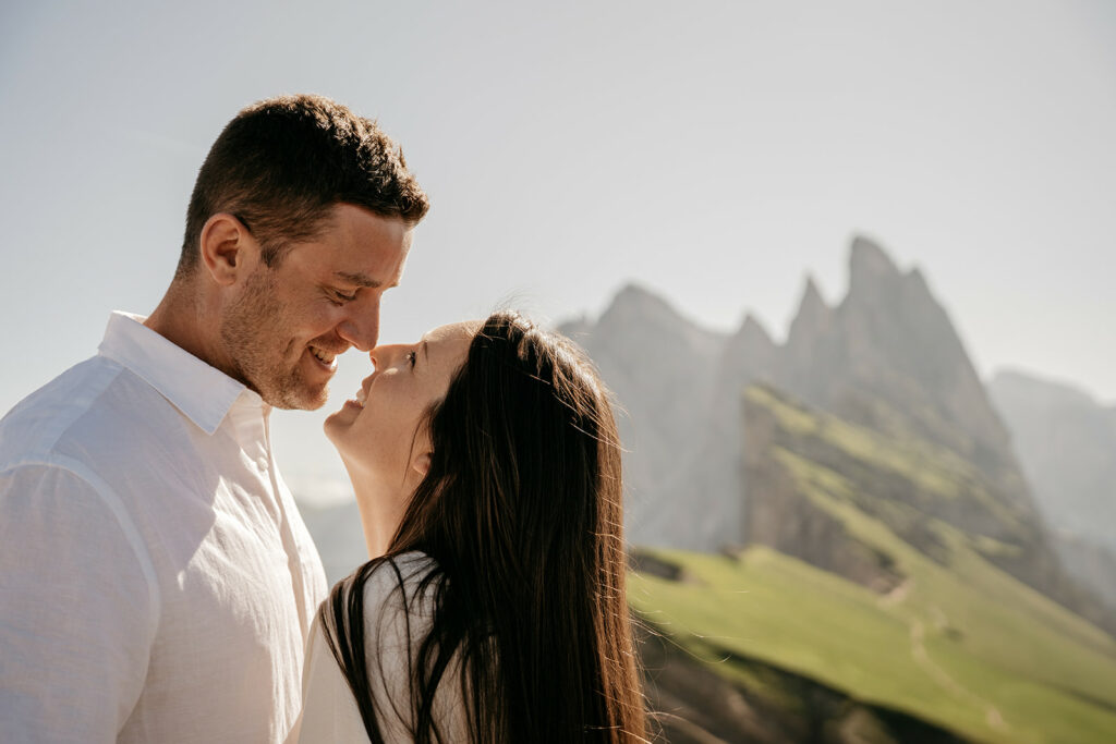 Couple smiling with mountain backdrop