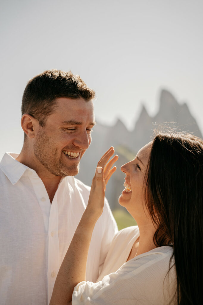 Smiling couple outdoors in sunlight
