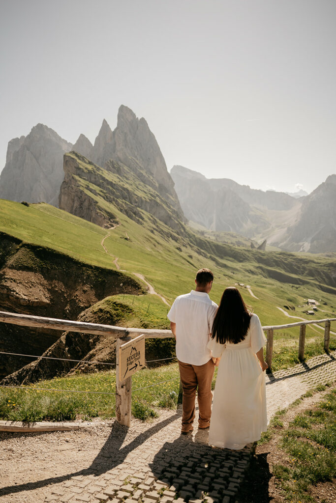 Couple enjoying scenic mountain views at Seceda.