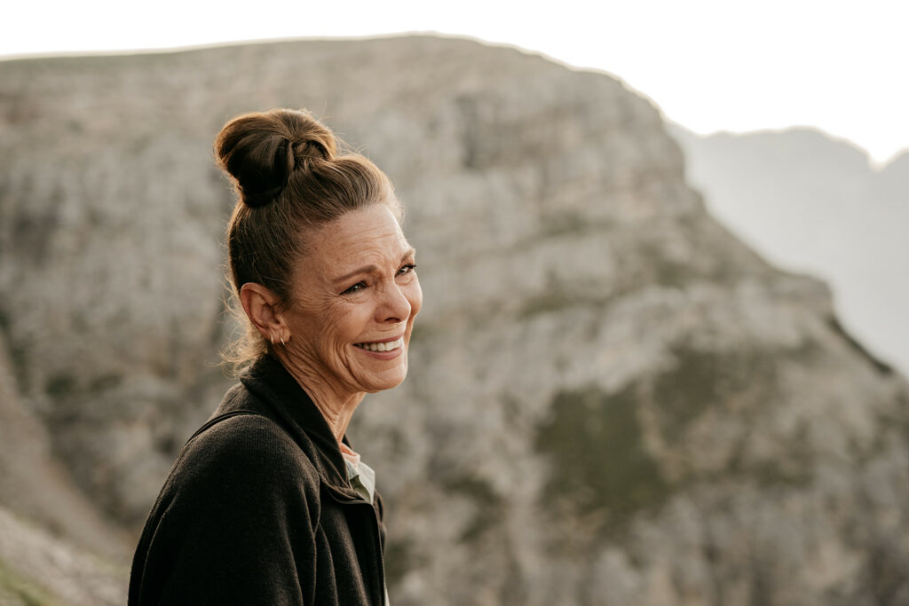 Smiling woman with bun hairstyle outdoors