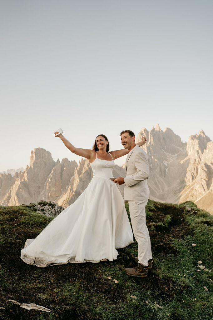 Couple smiling at mountain wedding ceremony