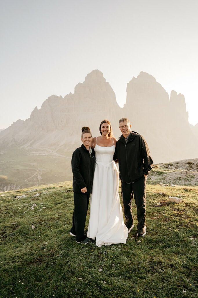Family poses with scenic mountain backdrop