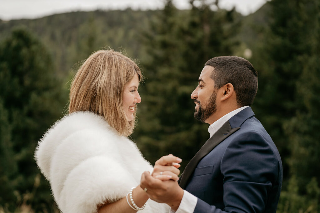 Smiling couple holding hands in nature