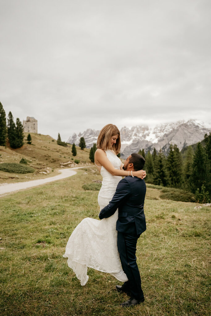 Couple embracing in scenic mountain landscape