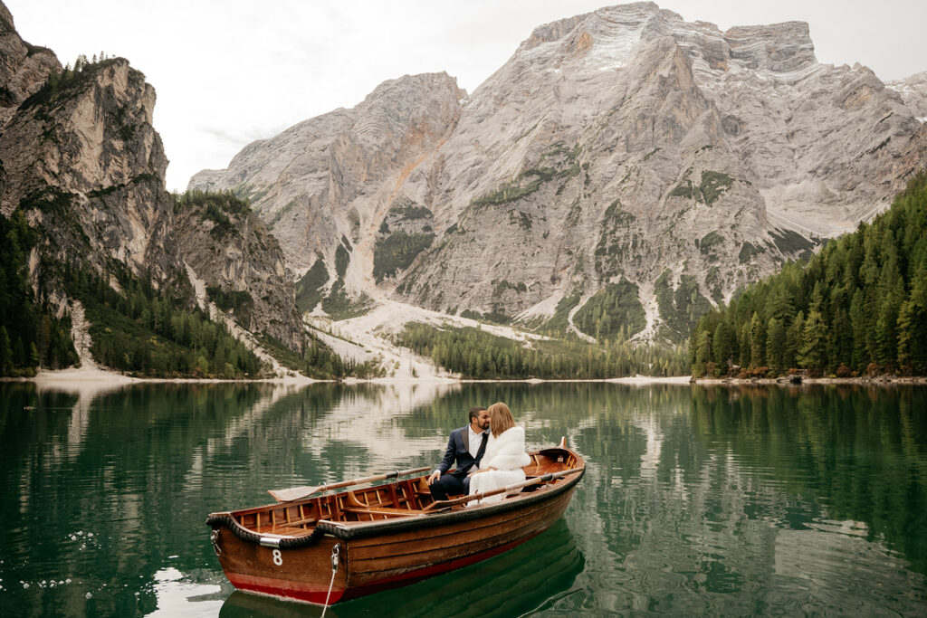 Couple in boat, mountain lake scenery