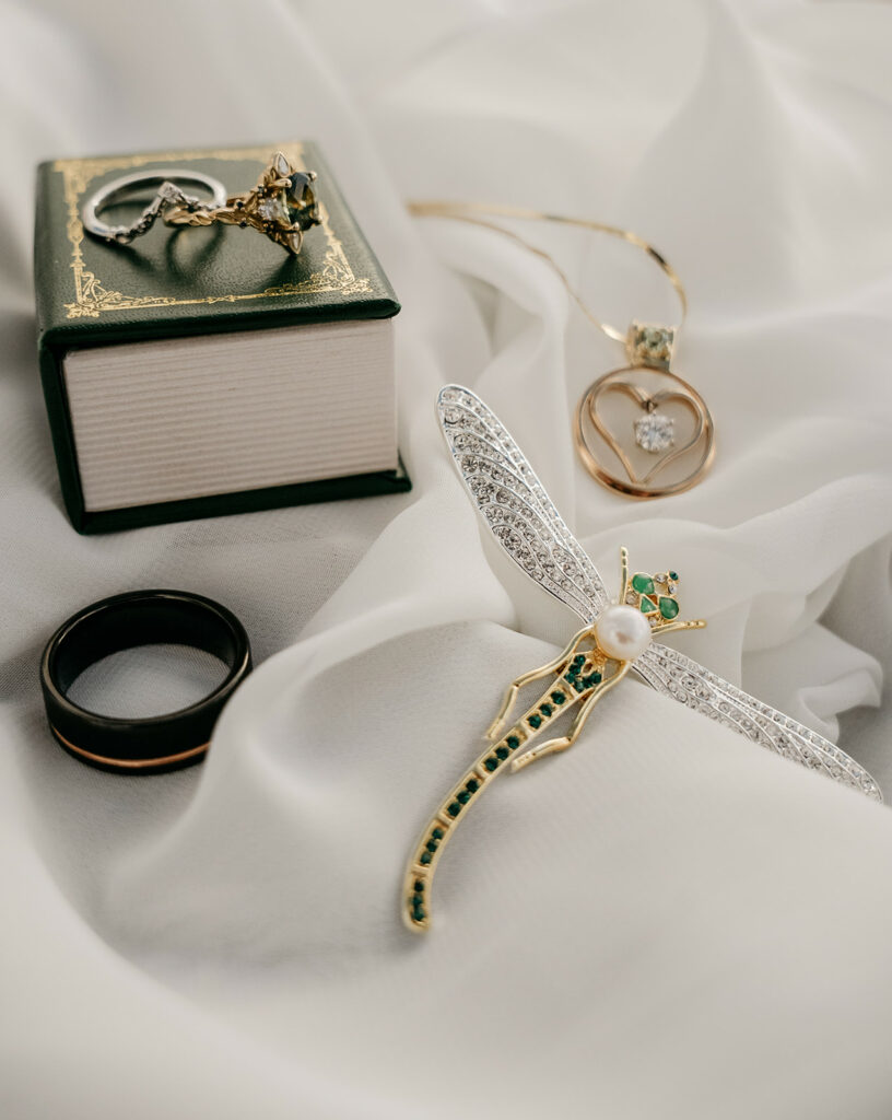 Jewelry pieces on a white fabric background.