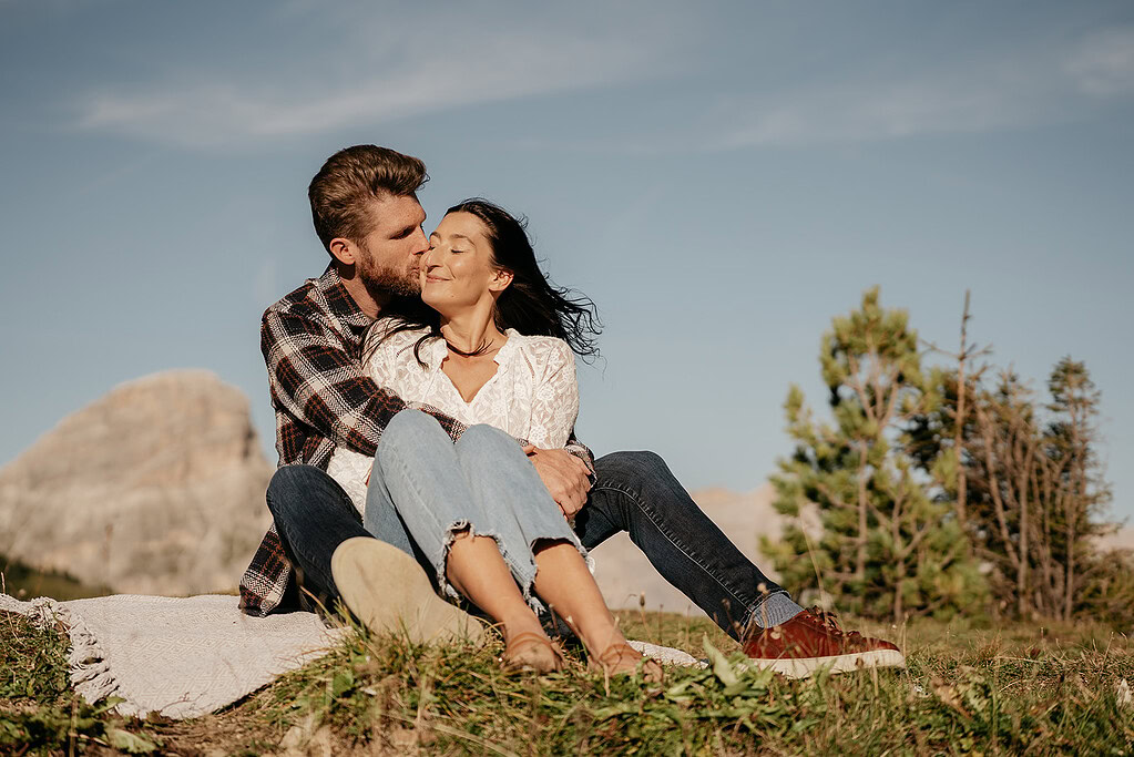Couple embracing in scenic mountain setting
