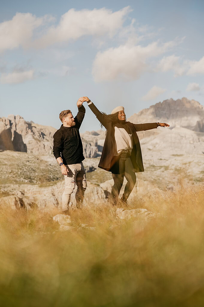 Couple dancing in mountain landscape