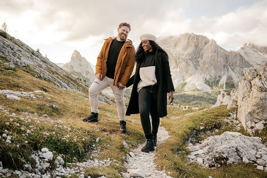 Couple hiking scenic mountain trail together