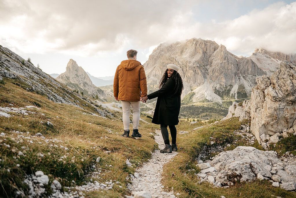 Couple hiking in scenic mountain landscape