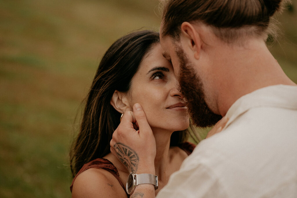 Couple gazing into each other's eyes lovingly.