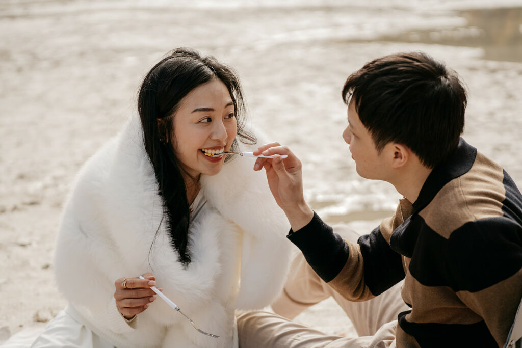 Couple enjoying a meal outdoors together.