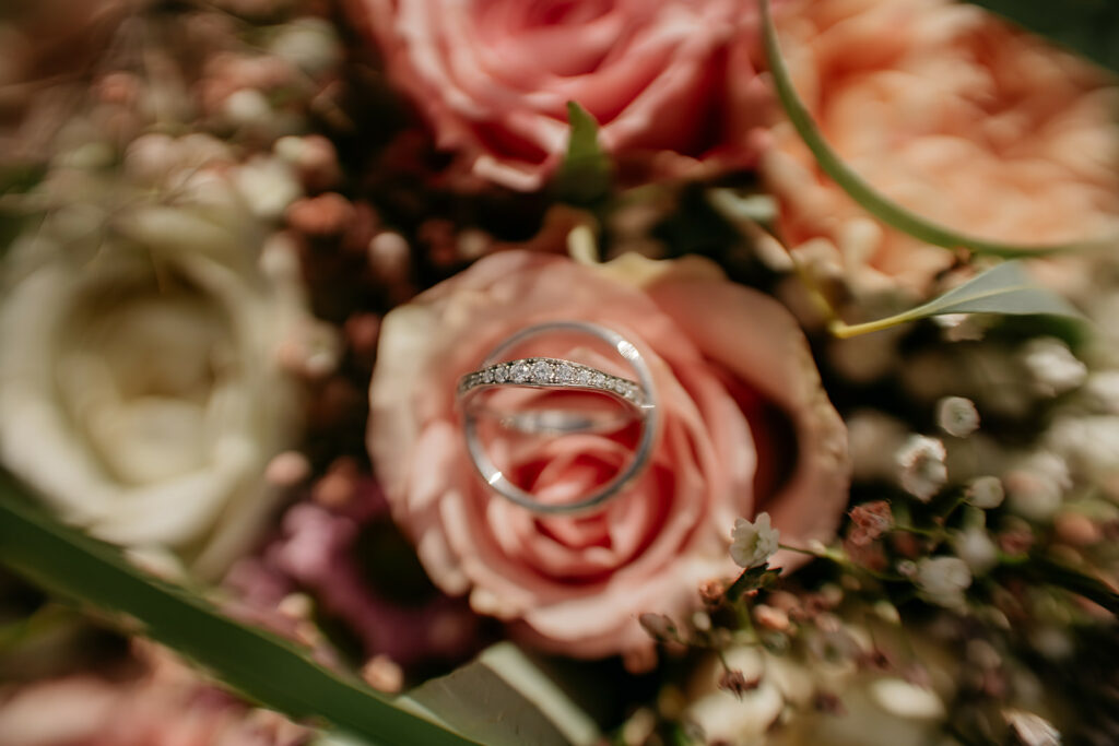 Diamond ring on pink rose bouquet
