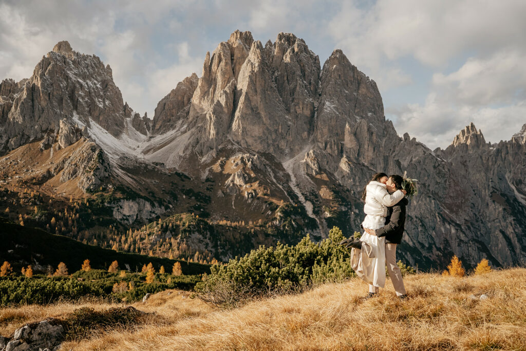 Couple embraces in mountain landscape