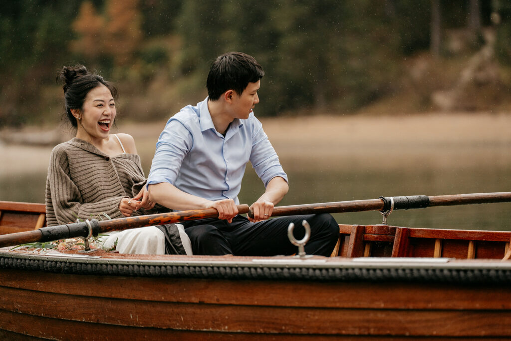 Couple enjoying a boat ride on a lake.