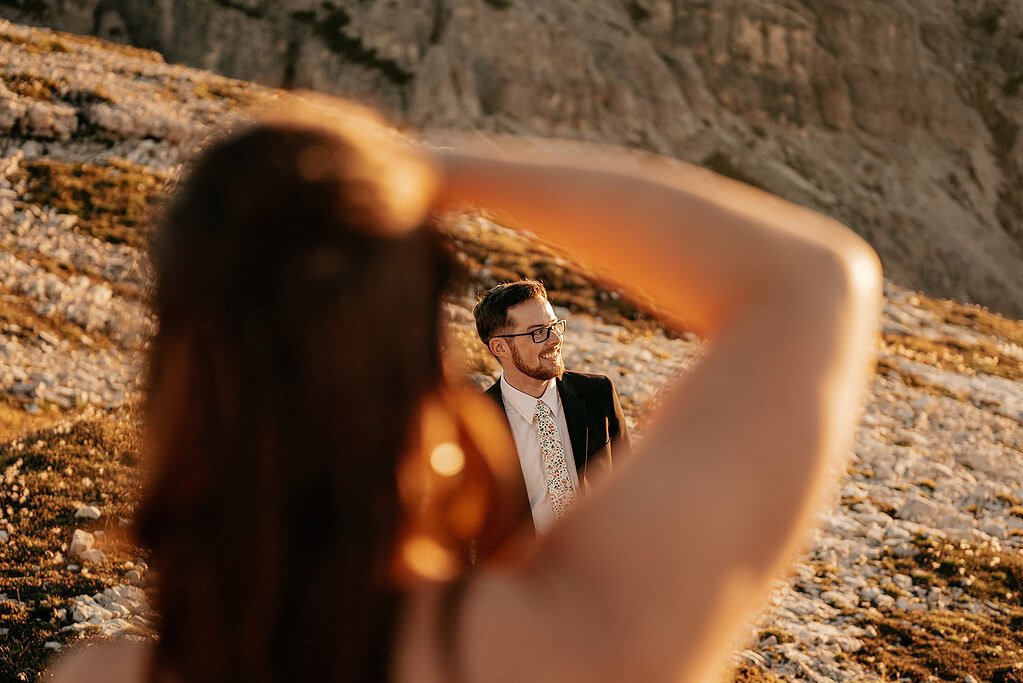 Man in suit photographed in rocky landscape